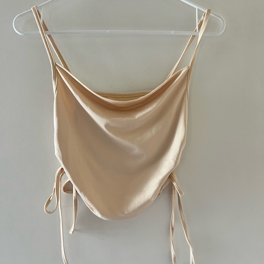 Cream tank top with ties on the side